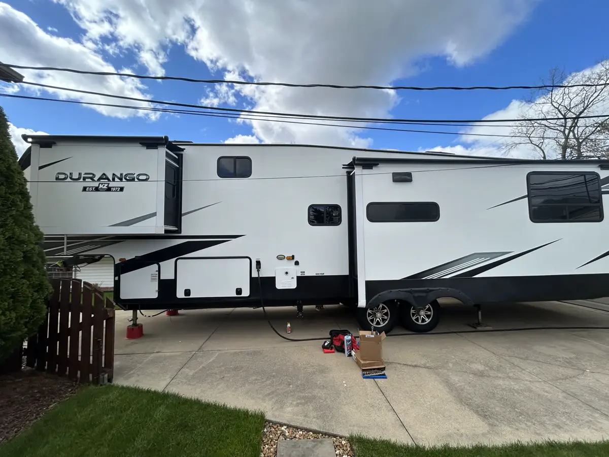 Mobile RV tools and parts staged for a preventive seasonal service visit.